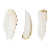 Three cream/serum swatches side by side on a pure white background, no packaging — one glossy fluid, one whipped balm, one thicker cream