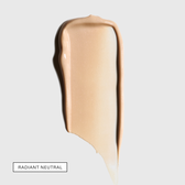 A single pale peach-beige tinted swatch on a light grey background with a boxed shade label in the lower left