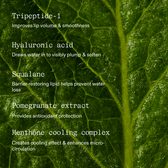 A five-ingredient list in white type set over a macro photograph of a backlit green leaf