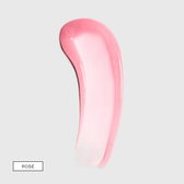 A curved smear of pink-tinted serum fading to sheer on light grey with a boxed shade label in the lower left