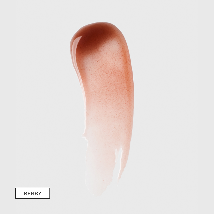 A curved smear of warm berry-tinted serum fading to sheer on light grey with a boxed shade label in the lower left
