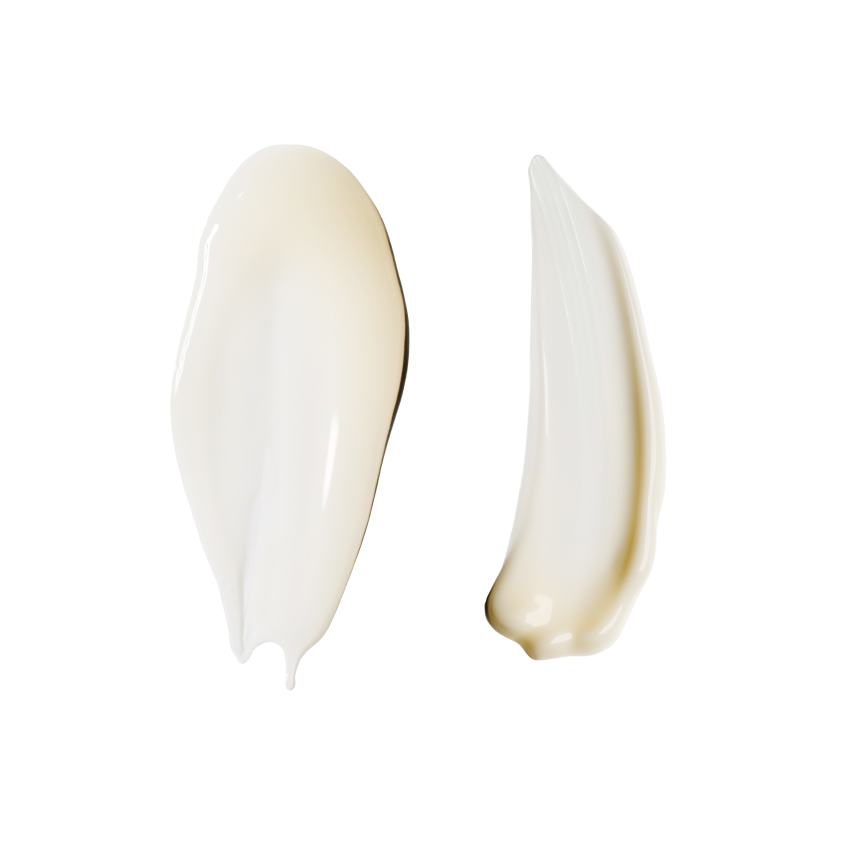 Two cream/balm swatches on pure white, no packaging — a broad pearly-white smear on the left and a narrower, warmer ivory smear on the right