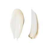 Two cream/balm swatches on pure white, no packaging — a broad pearly-white smear on the left and a narrower, warmer ivory smear on the right